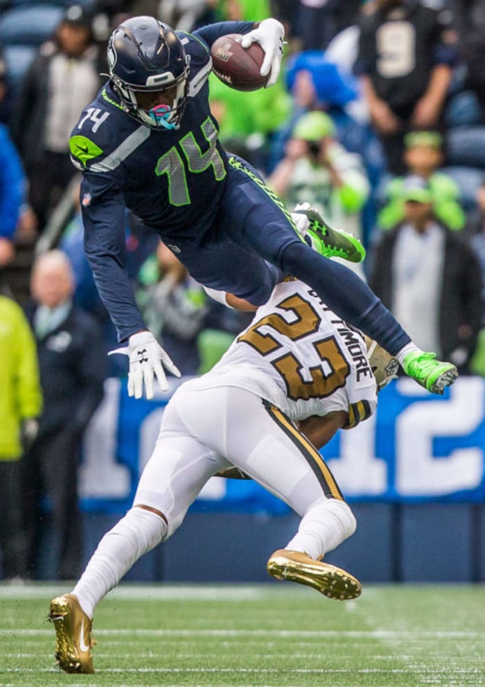Saints CB Marshon Lattimore (23) takes down Seahawks WR DK Metcalf (14) after a short reception. Credit: Everett Herald